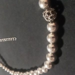 Silver beaded necklace with black crystals 16 + 2 inches long .